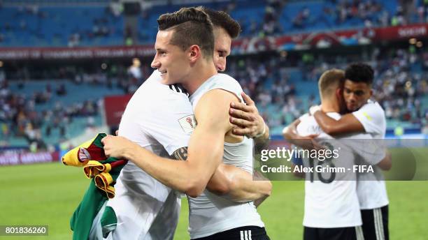 Julian Draxler and Niklas Suele of Germany embrace after the FIFA Confederations Cup Russia 2017 Group B match between Germany and Cameroon at Fisht...