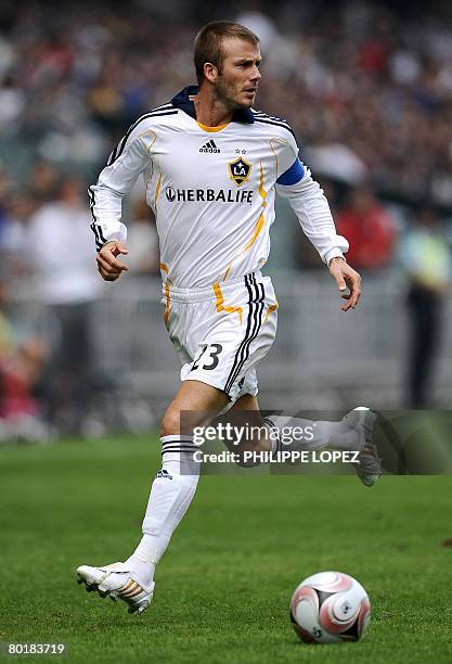 Galaxy's David Beckham vies for the ball during a tour match against South China at the Hong Kong Stadium on March 9, 2008. Beckham is using the...