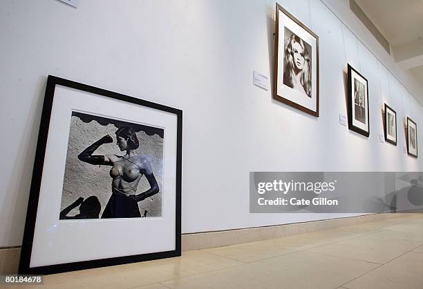 The photograph 'Tied up Torso, Ramatuelle, 1980' by Helmut Newton propped against the wall before it is hung beside other seductive photographs on...