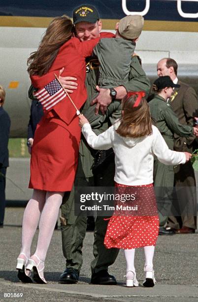 Navy EP-3 spy plane crew member Lt. Patrick Honeck greets his family during the crew's homecoming reception April 14, 2001 at the Whidbey Island...