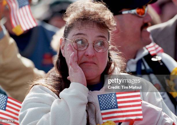 An unidentified woman wipes away a tear during the homecoming reception of the US Navy EP-3 spy plane crew April 14, 2001 at the Whidbey Island Naval...