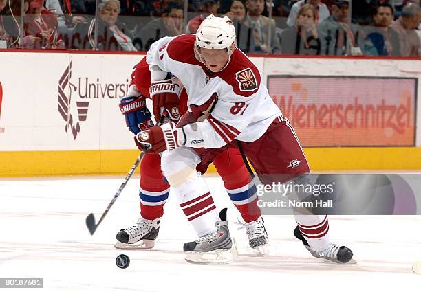 Left Wing Marcel Hossa of the Phoenix Coyotes races up ice with the puck against the Montreal Canadiens on March 6, 2008 at Jobing.com Arena in...