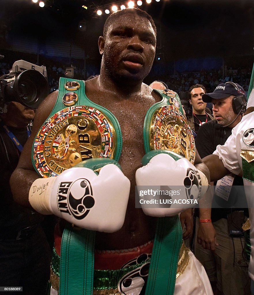 Nigerian Samuel Peter holds the belt of
