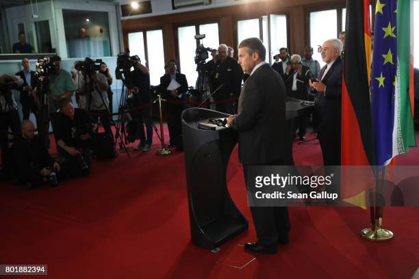 Iranian Minister of Foreign Affairs Mohammad Javad Zarif and German Foreign Minister Sigmar Gabriel speak to the media following talks on June 27,...