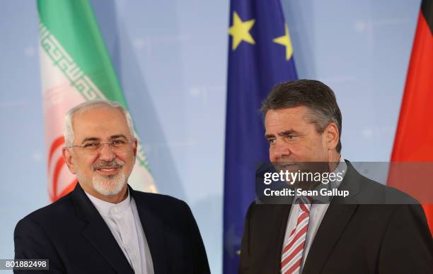 Iranian Minister of Foreign Affairs Mohammad Javad Zarif and German Foreign Minister Sigmar Gabriel prepare to depart after speaking to the media...