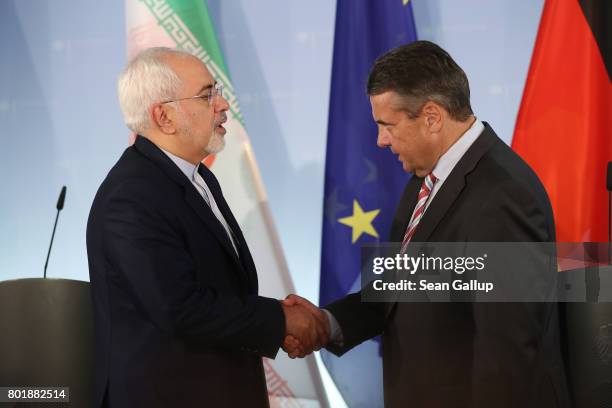 Iranian Minister of Foreign Affairs Mohammad Javad Zarif and German Foreign Minister Sigmar Gabriel prepare to depart after speaking to the media...