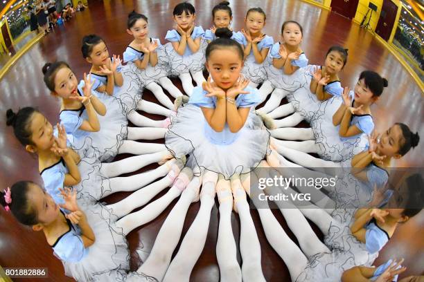 Children practice dance moves at a dance training centre on June 27, 2017 in Haozhou, Anhui Province of China. Under the guidance of professional...