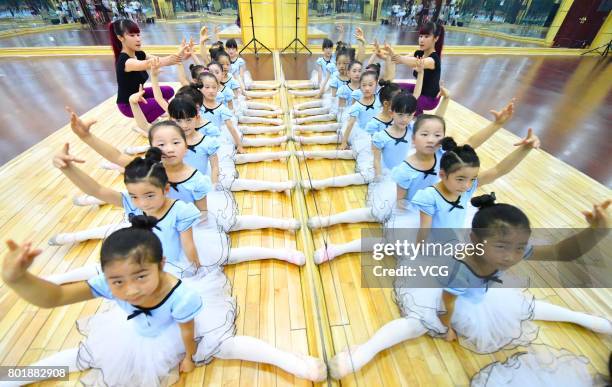 Children practice dance moves at a dance training centre on June 27, 2017 in Haozhou, Anhui Province of China. Under the guidance of professional...