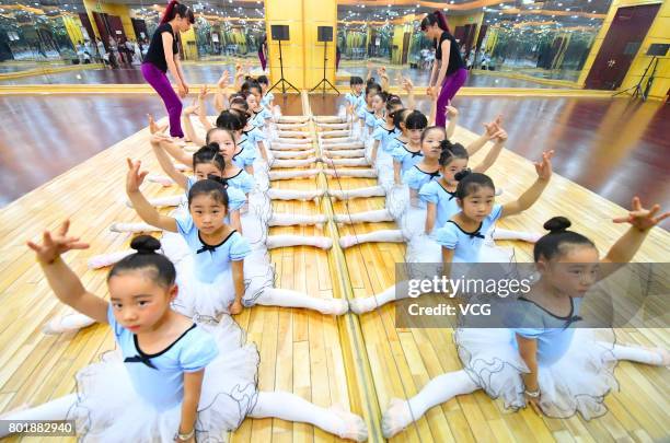 Children practice dance moves at a dance training centre on June 27, 2017 in Haozhou, Anhui Province of China. Under the guidance of professional...