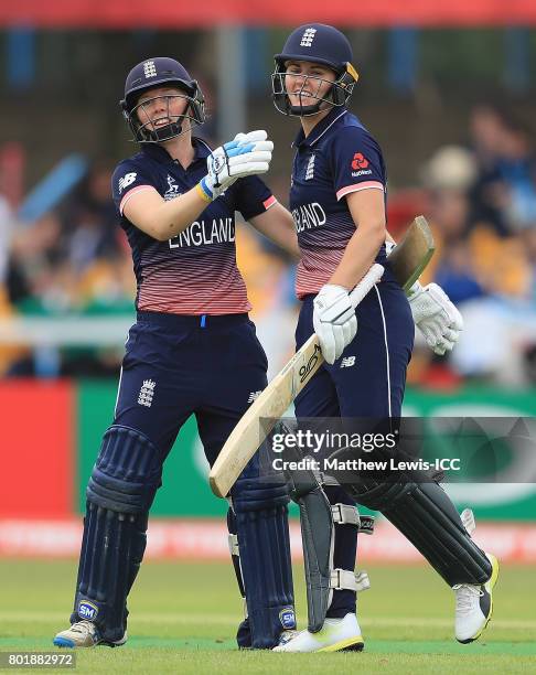 Heather Knight of England ceongratulates Natalie Sciver of England on her century during the ICC Women's World Cup 2017 match between England and...