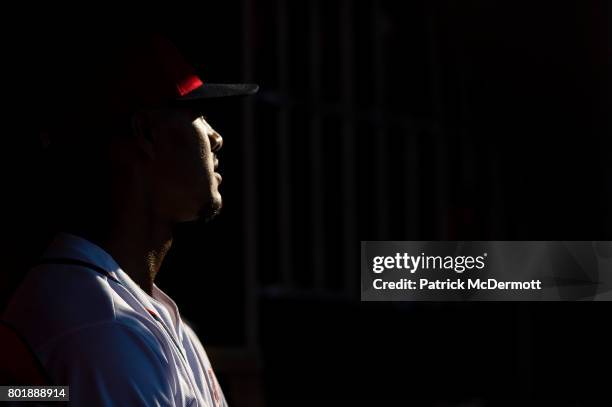 Joe Ross of the Washington Nationals sits in the dugout in the seventh inning during a game against the Cincinnati Reds at Nationals Park on June 24,...