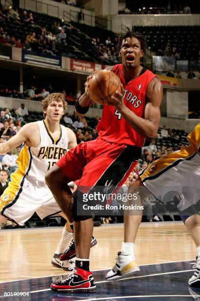 Chris Bosh of the Toronto Raptors drives to the basket during the game against the Indiana Pacers on February 25, 2008 at Conseco Fieldhouse in...