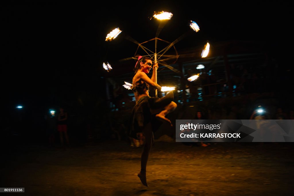 Amazing Fire Show at night on the beach.