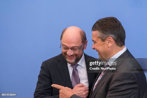 Chancellor candidate and chairman of Social Democratic Party Martin Schulz and Foreign Minister Sigmar Gabriel attend a news conference to illustrate...
