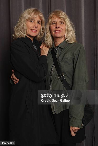 Twins Gisela Getty and Jutta Winkelmann pose for a photograph before a reading from their new book "Twins" at the Babylon movie theatre on March 10,...