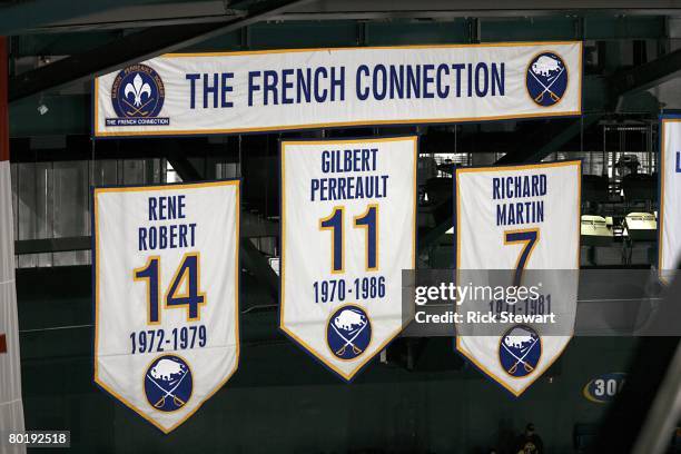 View of the banners of Rene Robert, Gilbert Perreault and Richard Martin that hang in the rafters during the NHL game of the Buffalo Sabres against...