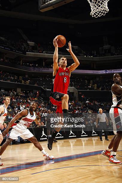 Jose Calderon of the Toronto Raptors takes the ball to the basket during the game against the Charlotte Bobcats at the Charlotte Bobcats Arena on...