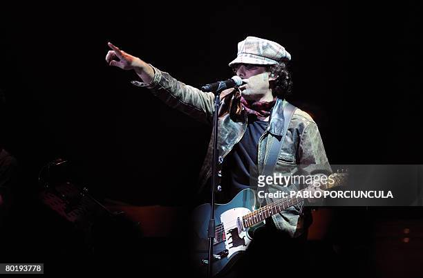 Argentine musician Andres Calamaro performs at the Charrua stadium in Montevideo on March 10 during his "Lengua popular" tour. AFP PHOTO / PABLO...