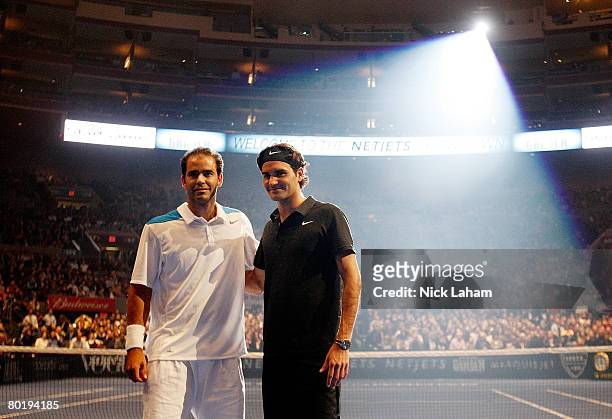 Pete Sampras and Roger Federer of Switzerland pose prior to their exhibition match on March 10, 2008 at Madison Square Garden in New York City.