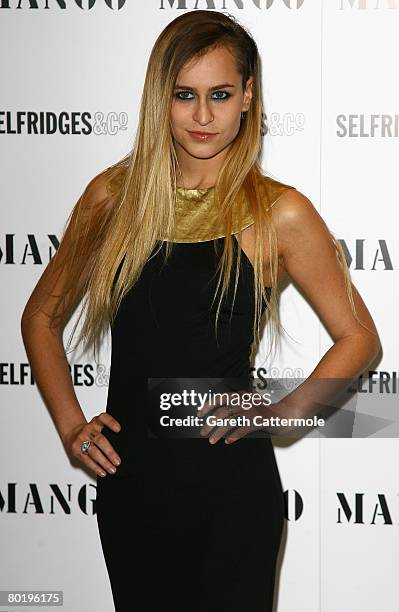 Model Alice Dellal poses at the launch of MNG 'Little Black Dress' collection by designer Osman Yousefzada at Selfridges on Oxford Street on March...