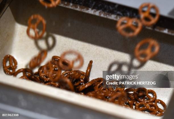 Photo taken on June 27, 2017 shows a Pretzel production line at the Boehli Bretzel factory in Gundershoffen, eastern France.