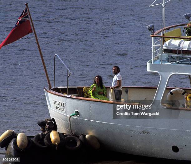 Elizabeth Taylor and Richard Burton on their yacht Kalizma, moored on the river Thames at Rotherhithe