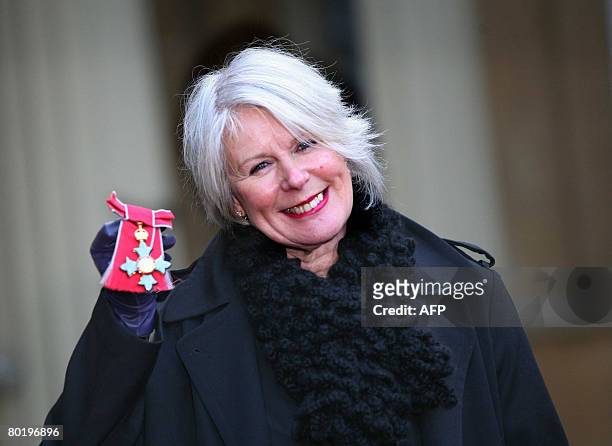 British fashion designer Betty Jackson is pictured outside Buckingham Palace, in London after collecting her MBE for services to the fashion...