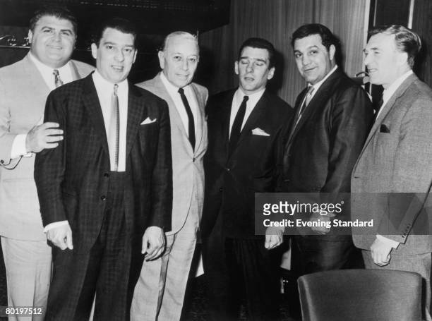London gangsters the Kray twins, Ronnie and Reggie with their brother Charlie and friends American actor George Raft and American former boxer Rocky...