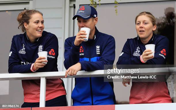 Natalie Sciver and Heather Knight of England look on, as rain stops play during the ICC Women's World Cup 2017 match between England and Pakistan at...