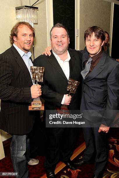 Actors Dean Andrews and Marshall Lancaster and radio presenter Chris Moyles pose in the awards room with the TV Crime Programme award sponsored by...