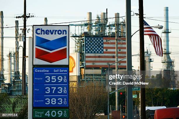 Gas station near the British Petroleum Arco Wilmington refinery advertises its gas prices after oil hits another new record at $109 a barrel on March...