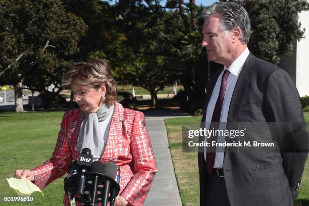 Attorney Gloria Allred and attorney John West, representing Judy Huth, speak during a trial setting conference of a civil suit against Bill Cosby at...