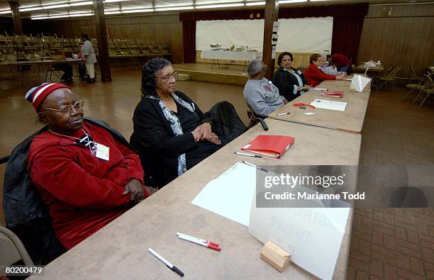 Mildred Graham and Ollie Perry wait for voters to come into their voting precinct during the Democratic primary March 11, 2008 in Meridian,...