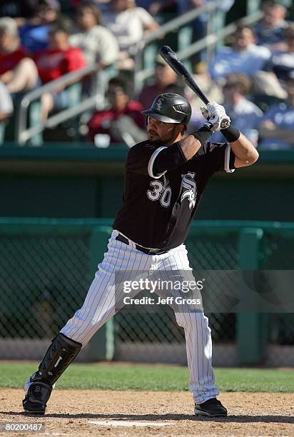 Nick Swisher of the Chicago White Sox readies for the pitch during a spring training game against the Los Angeles Angels of Anaheim at Tucson...