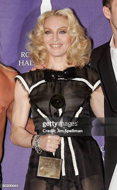 Inductee Madonna poses in the press room during the 23rd Annual Rock and Roll Hall of Fame Induction Ceremony at the Waldorf Astoria on March 10,...