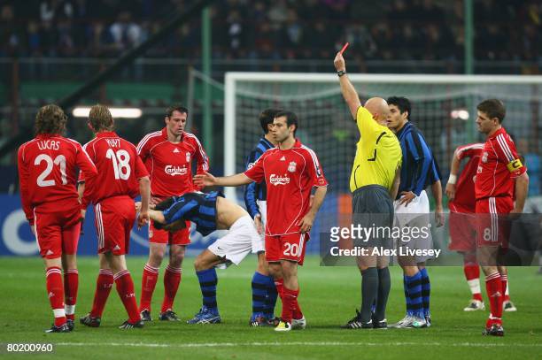 Nicolas Burdisso of Inter reacts after being shown the red card by Referee, Tom Henning Ovrebo of Norway for a bad challenge on Lucas Leiva of...