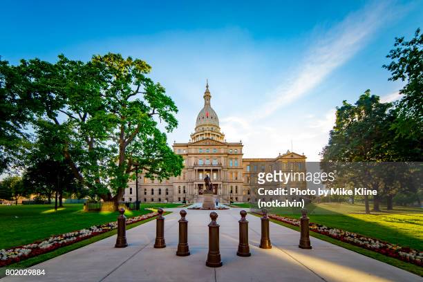 front view michigan state capitol building - sunset - michigan stock pictures, royalty-free photos & images
