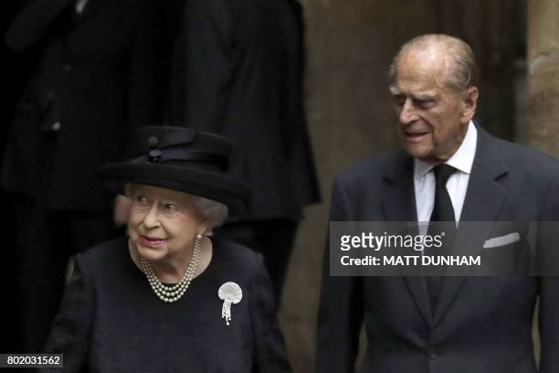Britain's Queen Elizabeth II and Britain's Prince Philip, Duke of Edinburgh leave after the funeral service of the 2nd Countess Mountbatten of Burma,...