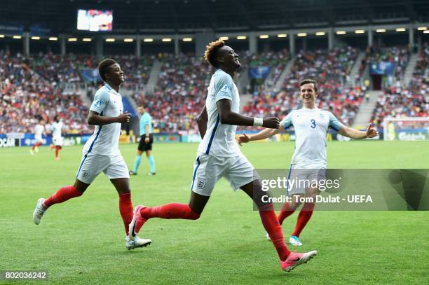 Tammy Abraham of England celebrates scoring his sides second goal with Demarai Gray of England and Ben Chilwell of England during the UEFA European...