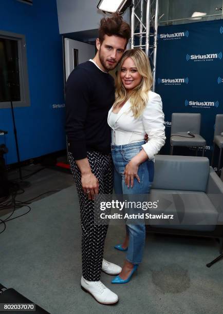 Actors Nico Tortorella and Hilary Duff from the cast of YOUNGER pose for photos SiriusXM's Town Hall on June 27, 2017 in New York City.