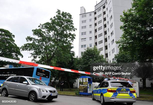 Police car stands in front of a residential building which was evacuated on June 27, 2017 in Wuppertal, Germany. German authorities evacuated a...