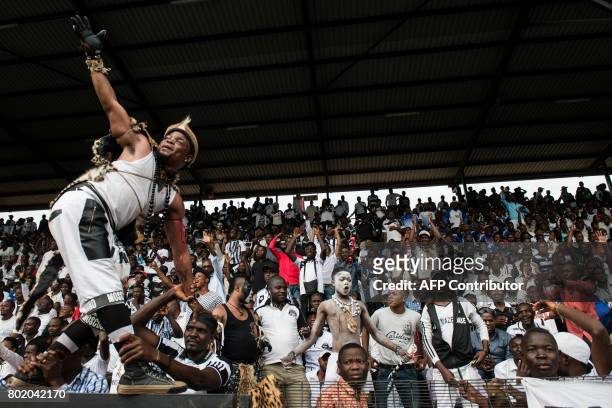 This photograph taken on May 14 shows supporters of the Tout-Puissant Mazembe cheering before the start of the CAF Confederations Cup quarter-finals...