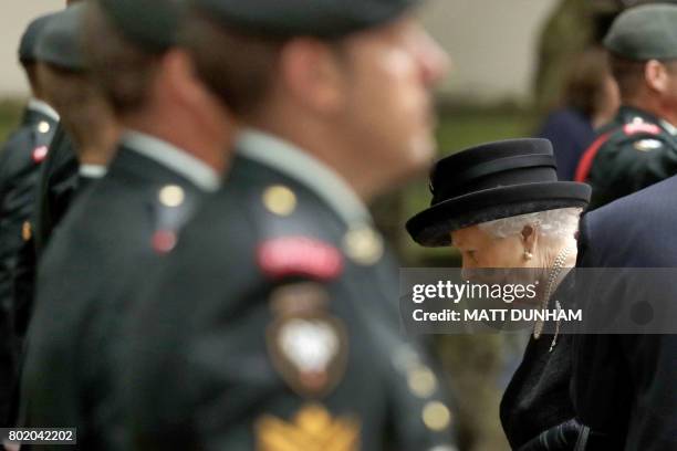 Britain's Queen Elizabeth II passes members of the Second Battalion, Princess Patricia's Canadian Light Infantry , known as "The Patricia's", as she...
