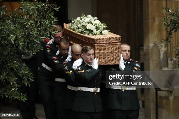 Members of the Second Battalion, Princess Patricia's Canadian Light Infantry , known as "The Patricia's", carry the wicker casket, decorated with...