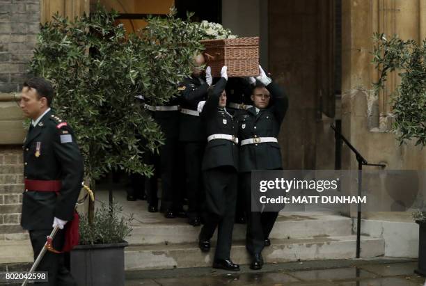 Members of the Second Battalion, Princess Patricia's Canadian Light Infantry , known as "The Patricia's", carry the wicker casket, decorated with...