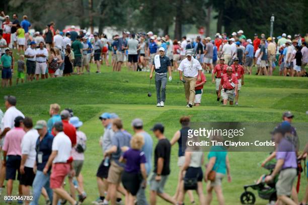 June 25: Boo Weekley and Jordan Spieth head down the sixth fairway during the fourth round of the Travelers Championship Tournament at the TPC River...