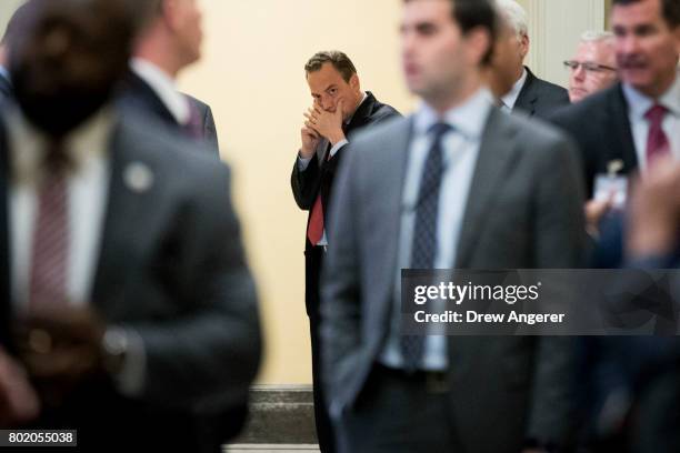 White House Chief of Staff Reince Priebus talks on a cell phone before a closed-door Senate GOP conference meeting on Capitol Hill, June 27, 2017 in...