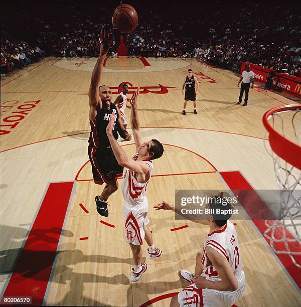 Shawn Marion of the Miami Heat shoots against Yao Ming of the Houston Rockets during the game at the Toyota Center on February 21, 2008 in Houston,...