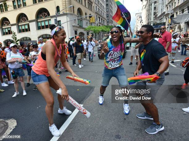 Shavonte Zellous and Kiah Stokes of the New York Liberty dance with Bill Kennedy in the NYC Pride Parade on June 25, 2017 in New York City, New York....