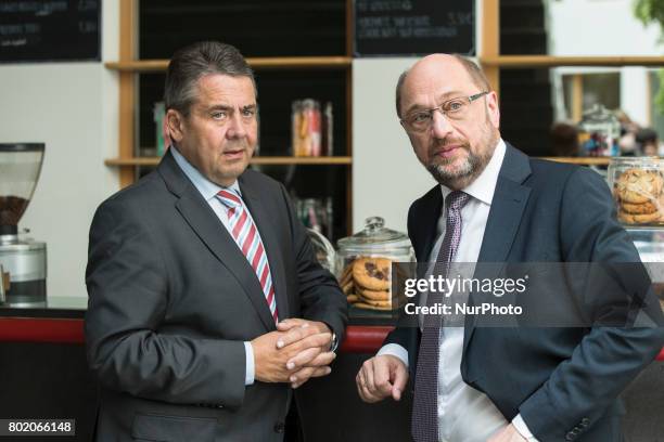 Chancellor Candidate and chairman of the Social Democratic Party Martin Schulz chats with foreign minister Sigmar Gabriel after a news conference to...